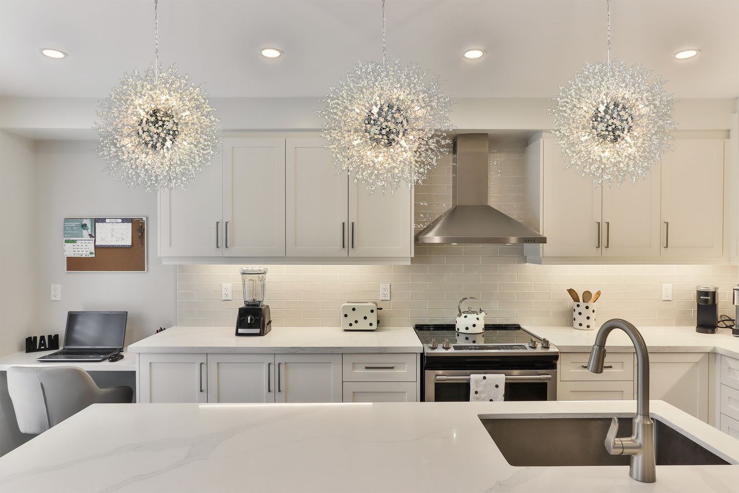 Luxury crystal chandelier over kitchen island with polished chrome finish