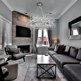 Chrome starburst chandelier hanging above table