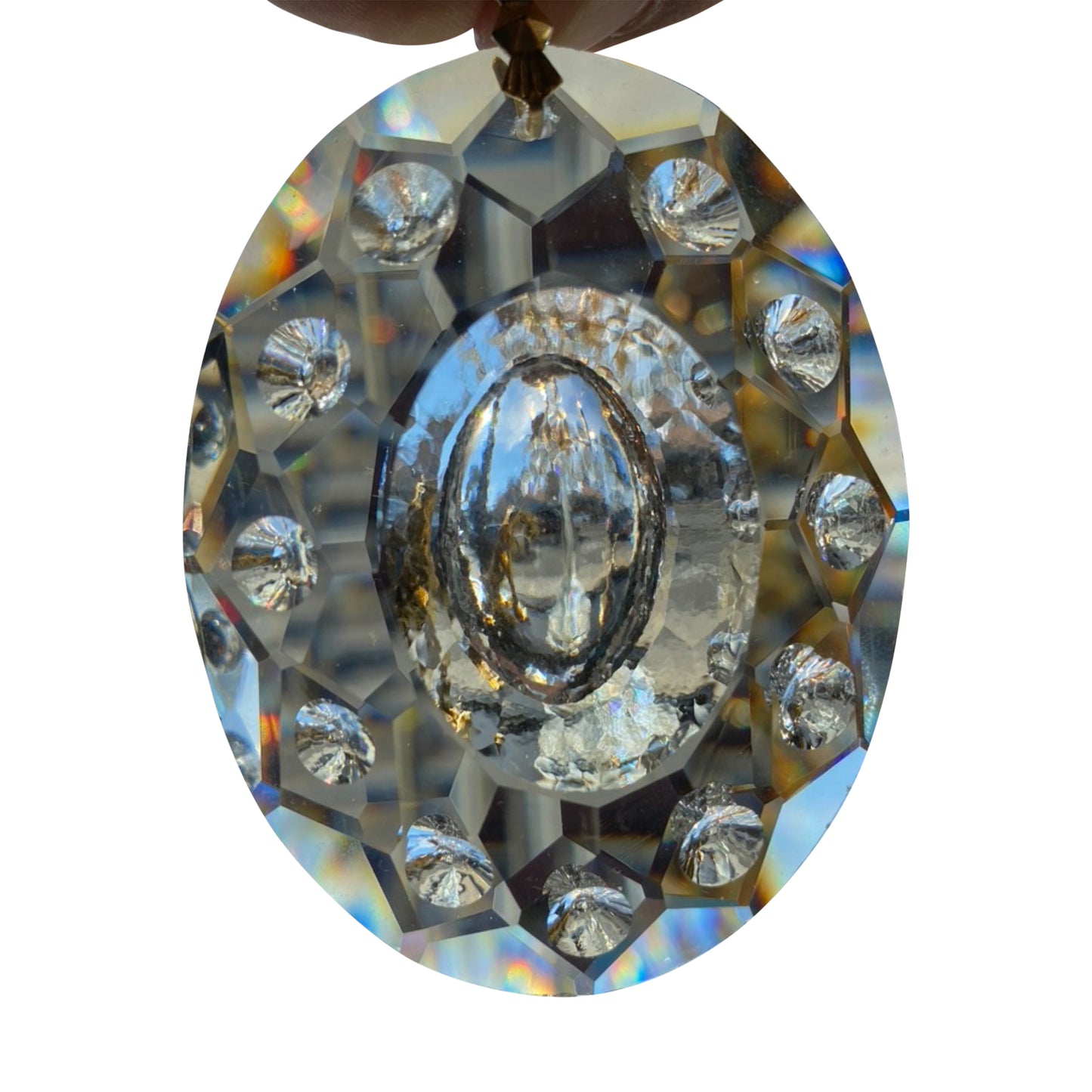 A close-up image of a clear, oval-shaped full-lead crystal egg with intricate detailing and a pre-drilled hole at the top for hanging.